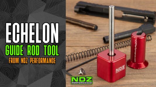 NDZ Guide Rod Tool for the Springfield Echelon displayed on a wooden table, with various handgun parts in the background. The image features the NDZ Performance branding