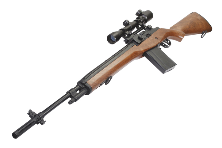 Wood-stocked rifle fitted with a telescopic sight on a side-rail scope mount
