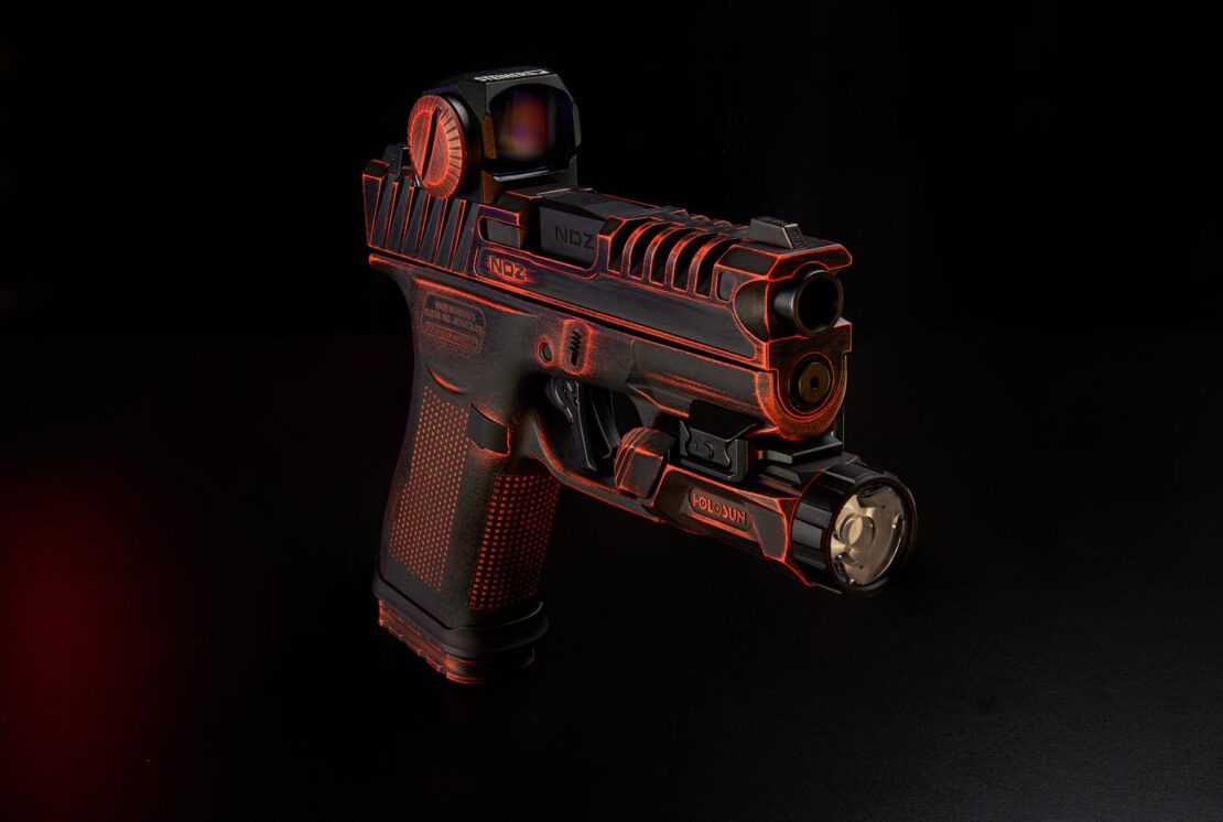 The Glocktober giveaway build: a custom Glock 43X with the NDZ A.R.E.S. slide in a distressed black and orange finish, a Steiner micro optic, and a Holosun light, on a black background.